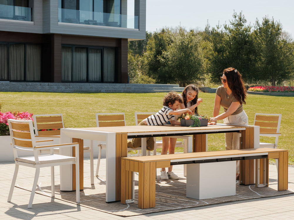 Transformer-outdoor-table-light-oak-the-host-4-panels-5-chairs-lifestyle-models-4x3_4c2f546f-6625-46b8-bd5f-eac1ee5dc732